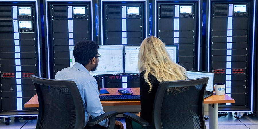 Two users work with the RTDS Simulator