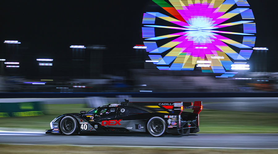 Wayne Taylor Racing vehicle races in the night at the Rolex 24 at Daytona 2025