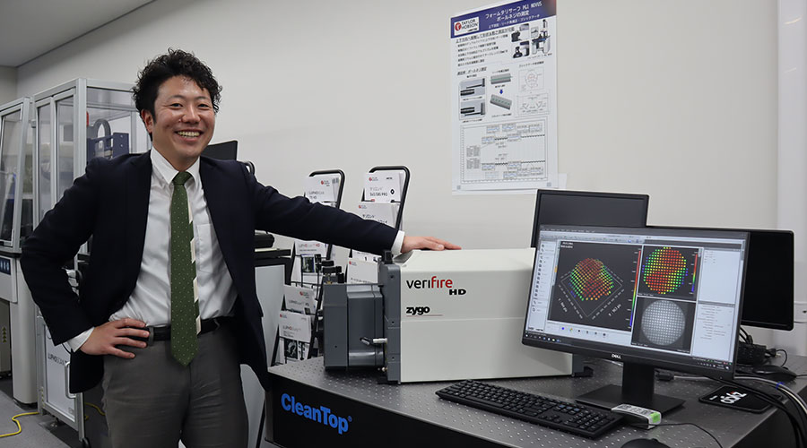 Naoki poses with Zygo's Verifire product at AMETEK Japan's Customer Solutions Center
